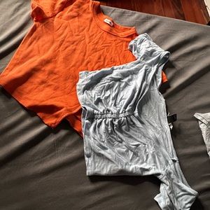 one orange crop top and one light blue crop top